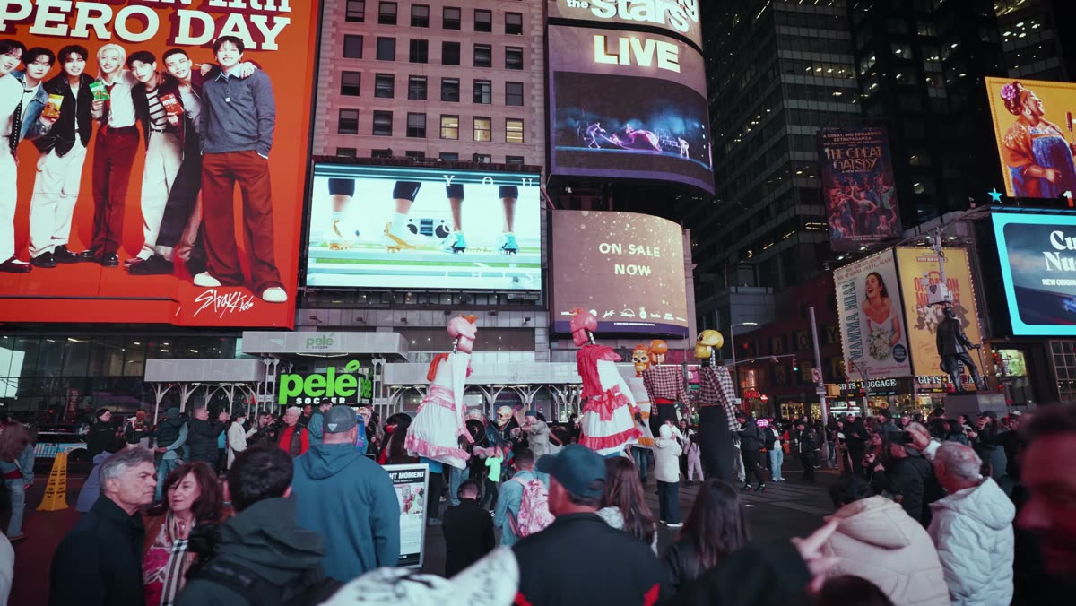 Catrinas and giant mojigangas among the crowd in Times Square